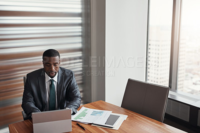 Buy stock photo Black man, banker and laptop in office for finance, research and paperwork plan for growth. Male person, online proposal and review credit report for feedback at insurance agency, analyst and stats