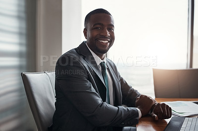 Buy stock photo Cropped portrait of a handsome businessman working in his corporate office