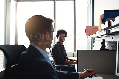 Buy stock photo Cropped shot of two businesspeople taking in an office