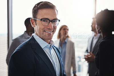Buy stock photo Cropped portrait of a handsome businessman standing in the boardroom during a meeting