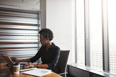 Buy stock photo Cropped shot of an attractive businesswoman working in her corporate office