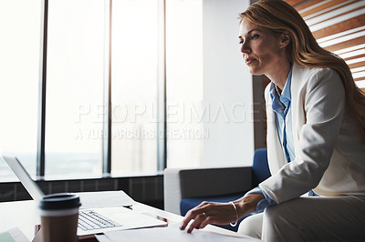 Buy stock photo Cropped shot of an attractive businesswoman working in her corporate office