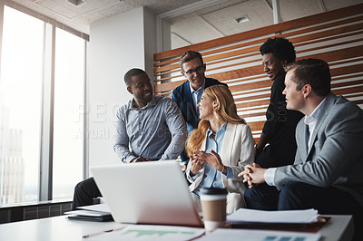 Buy stock photo Shot of a group of businesspeople having a discussion in an office