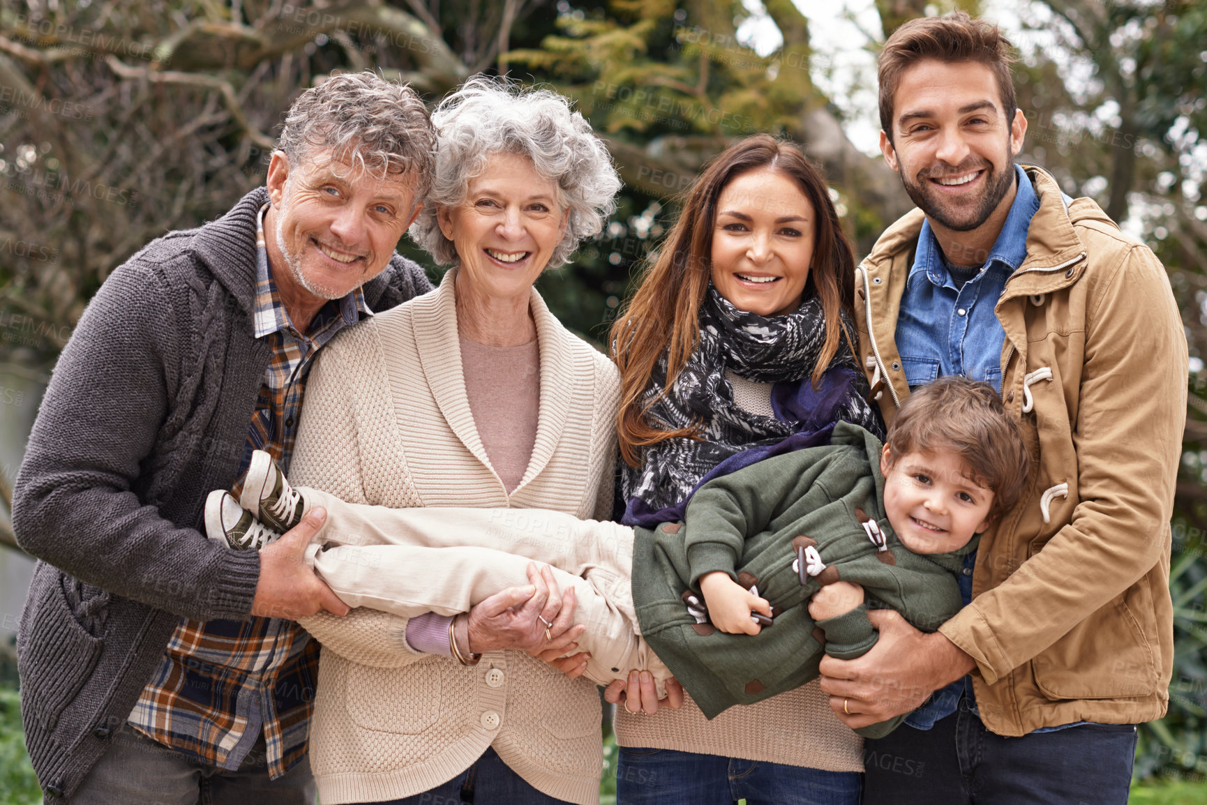 Buy stock photo Happy family, grandparents and portrait of parents with kid in a park on outdoor vacation, holiday and excited together. Mother, faces and father playing with child for love, care and in nature