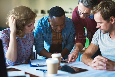 Buy stock photo Shot of a diverse group of businesspeople collaborating on a project in a modern office