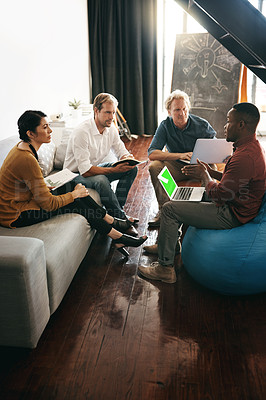 Buy stock photo Shot of a diverse group of designers brainstorming together in an office