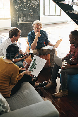 Buy stock photo Shot of a diverse group of designers brainstorming together in an office