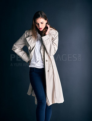 Buy stock photo Woman, fashion and style with coat for winter clothing, makeup or cosmetics on a dark studio background. Young female person or model posing with trendy or stylish casual outfit on mockup space