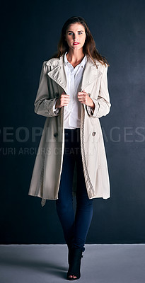 Buy stock photo Studio shot of a stylishly dressed young woman posing against a coloured background 