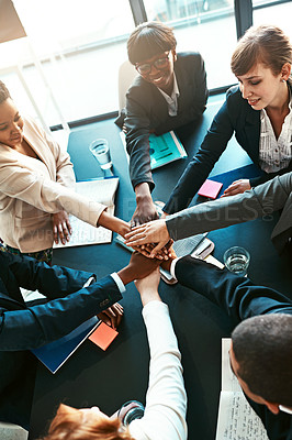 Buy stock photo Diversity, business and people hands together in office for unity with support, trust and collaboration for work project. Above, group and huddle for teamwork with paperwork for partnership and goals