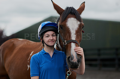 Buy stock photo Teenager, horse and portrait outdoor for equestrian, development and learning with bonding or connection. Girl, animal and pet by stable for riding, care and fitness with smile, exercise and helmet
