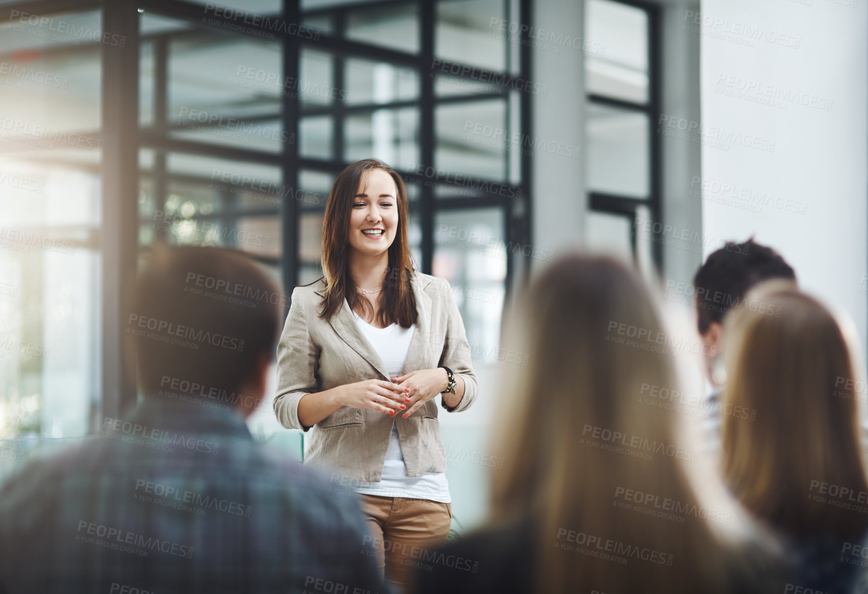 Buy stock photo Happy, businesswoman and meeting or presentation for recruitment and onboarding in the boardroom. Female manager, and employee crowd for discussion or conversation on training in seminar at office