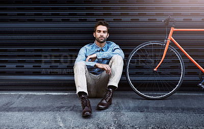 Buy stock photo Portrait, man and fashion with bicycle by wall for transport of creative business worker by lens flare. Confident, male person and beauty with elegant clothing leaning grey brick for designer career
