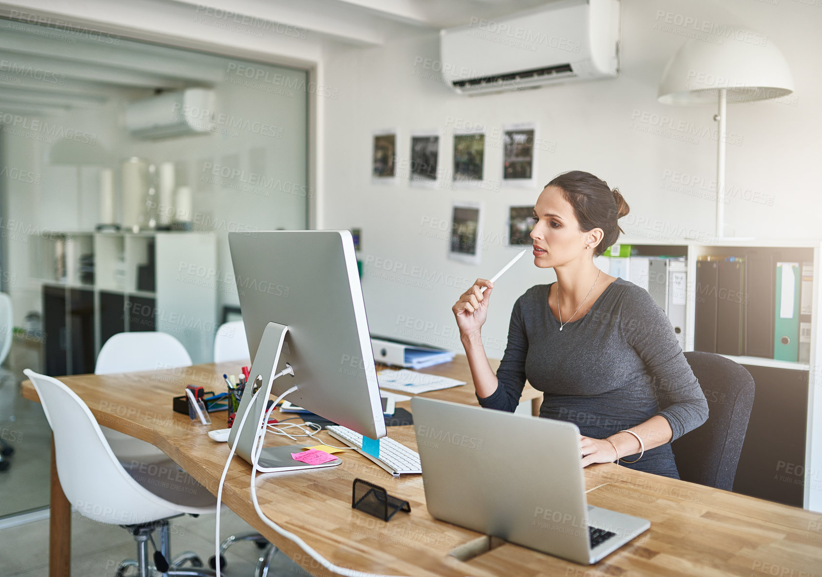 Buy stock photo Cropped shot of a pregnant businesswoman working on her computer in the office