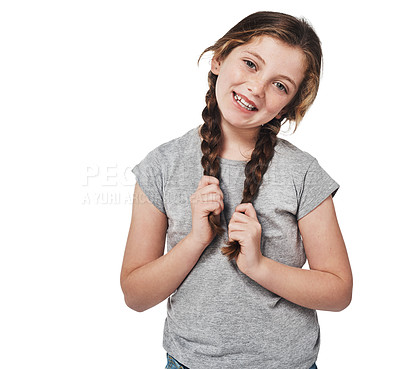 Buy stock photo Studio portrait of a happy young girl posing against a white background