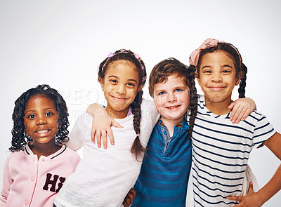 Buy stock photo Happy, hug and portrait of children on a white background for friendship, community and support. Fashion, childhood and isolated young girls and boys with trendy, style and casual clothes in studio