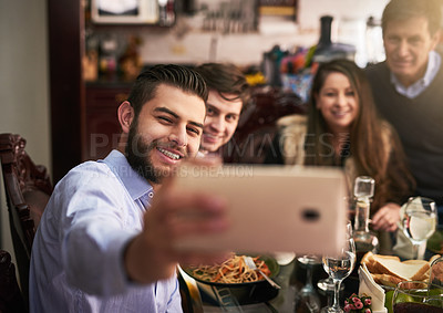 Buy stock photo Happy family, smile and selfie by dinner table for photography, memory or social media together at home. Men, parents and bonding with reunion for picture, thanksgiving or holiday dining at house