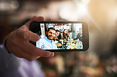 Buy stock photo Cropped shot of a family taking a picture during dinner at home