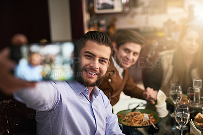 Buy stock photo Family, smile and selfie by dinner table for photography, memory or social media together at home. Happy men, parents and bonding with reunion for picture, thanksgiving or holiday dining at house