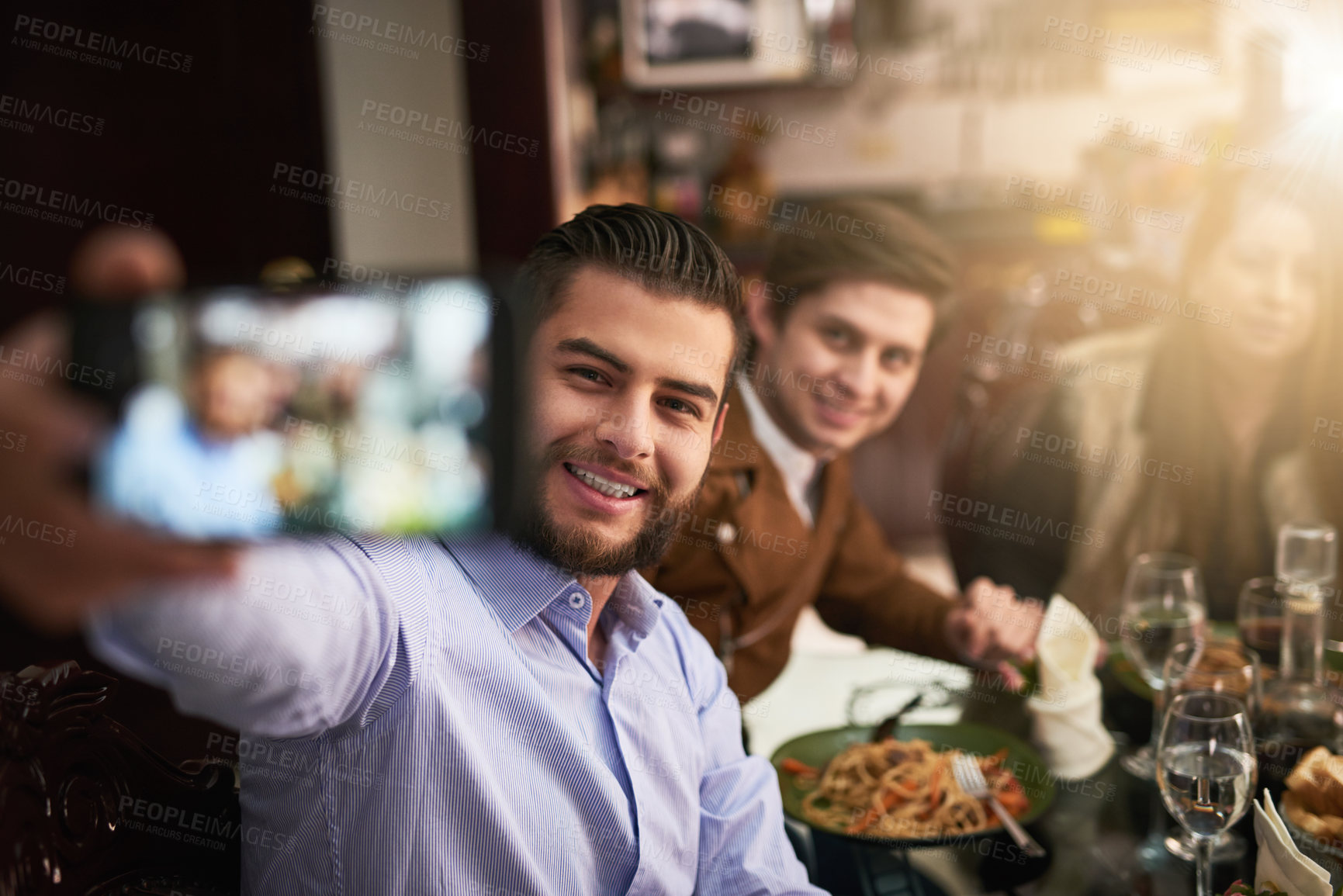 Buy stock photo Family, smile and selfie by dinner table for photography, memory or social media together at home. Happy men, parents and bonding with reunion for picture, thanksgiving or holiday dining at house