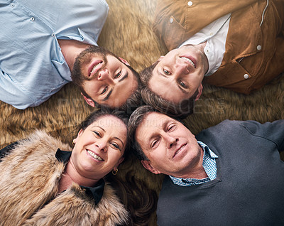 Buy stock photo High angle shot of a family at home