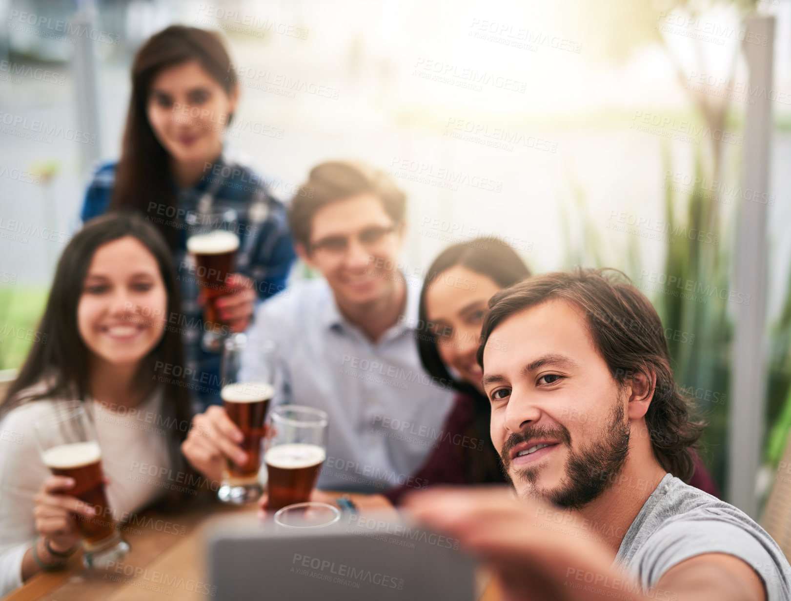 Buy stock photo Cafe, selfie and group of friends with beer, social celebration and relax at table together with smile. Photography, men and women in restaurant with drinks, solidarity and happy weekend reunion.