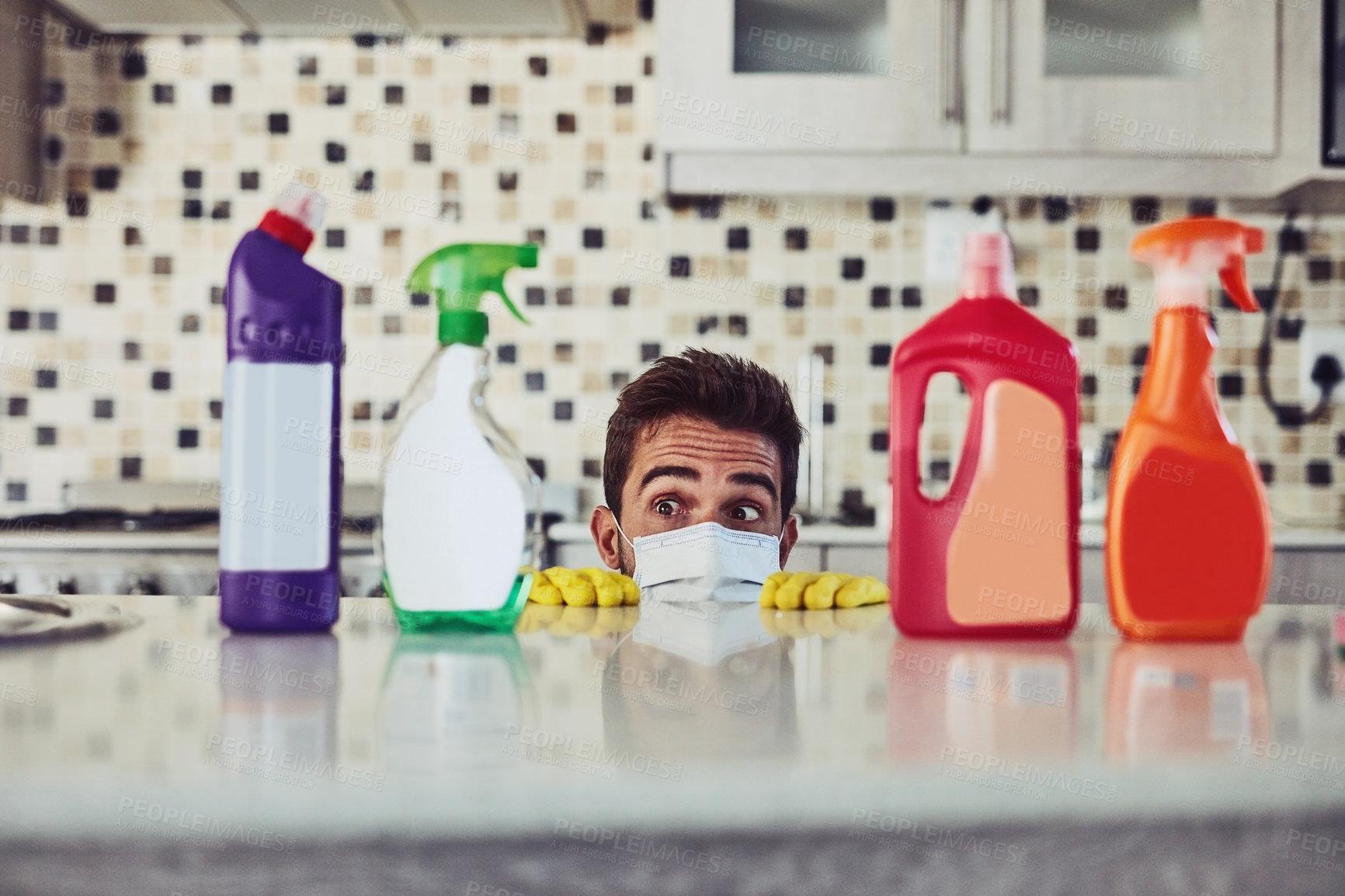 Buy stock photo Shot of a handsome young man cleaning his home