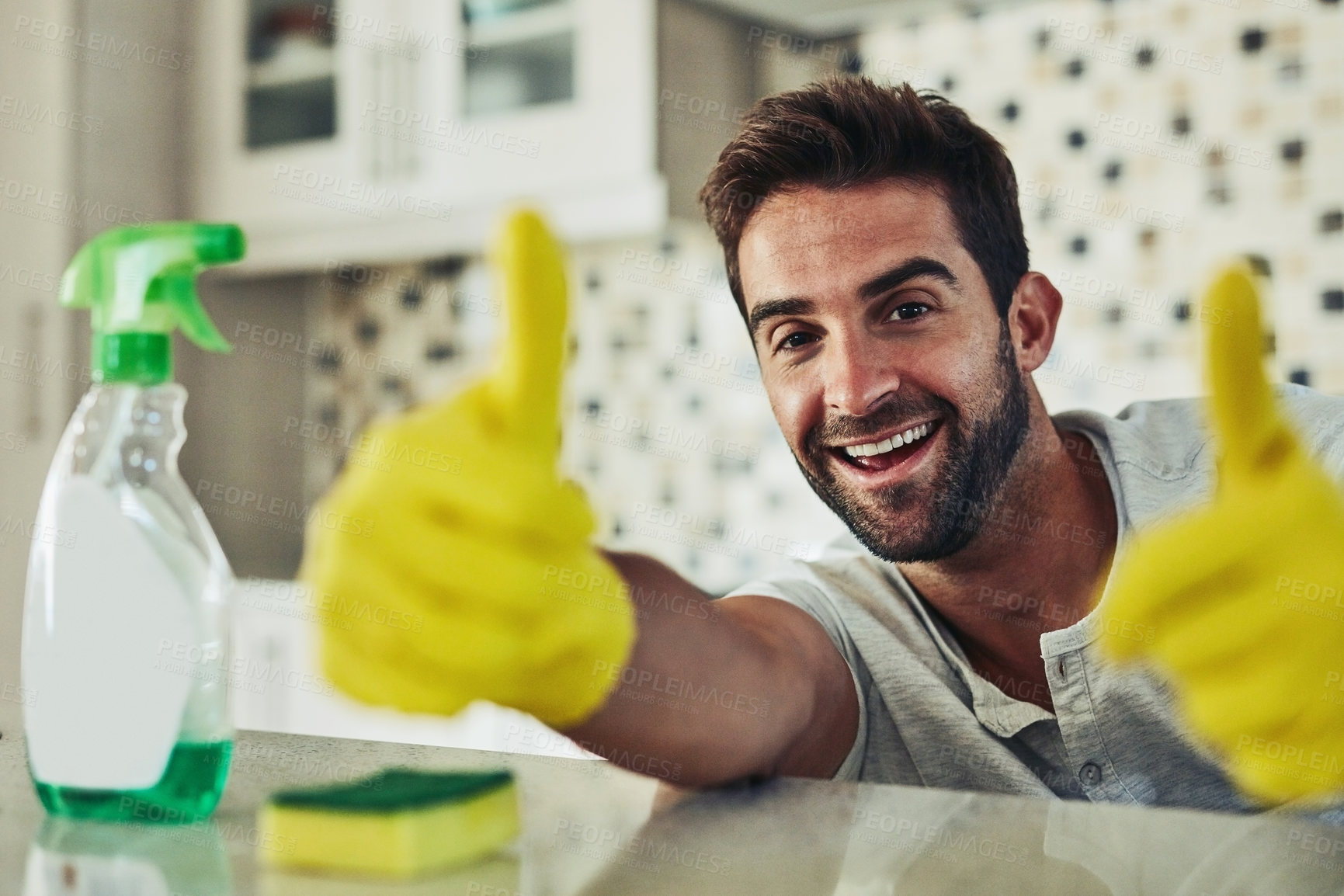 Buy stock photo Cleaning, kitchen and portrait of happy man with thumbs up in gloves for hygiene, disinfection and washing. Housekeeping, home and person with spray bottle detergent for cleaner service satisfaction