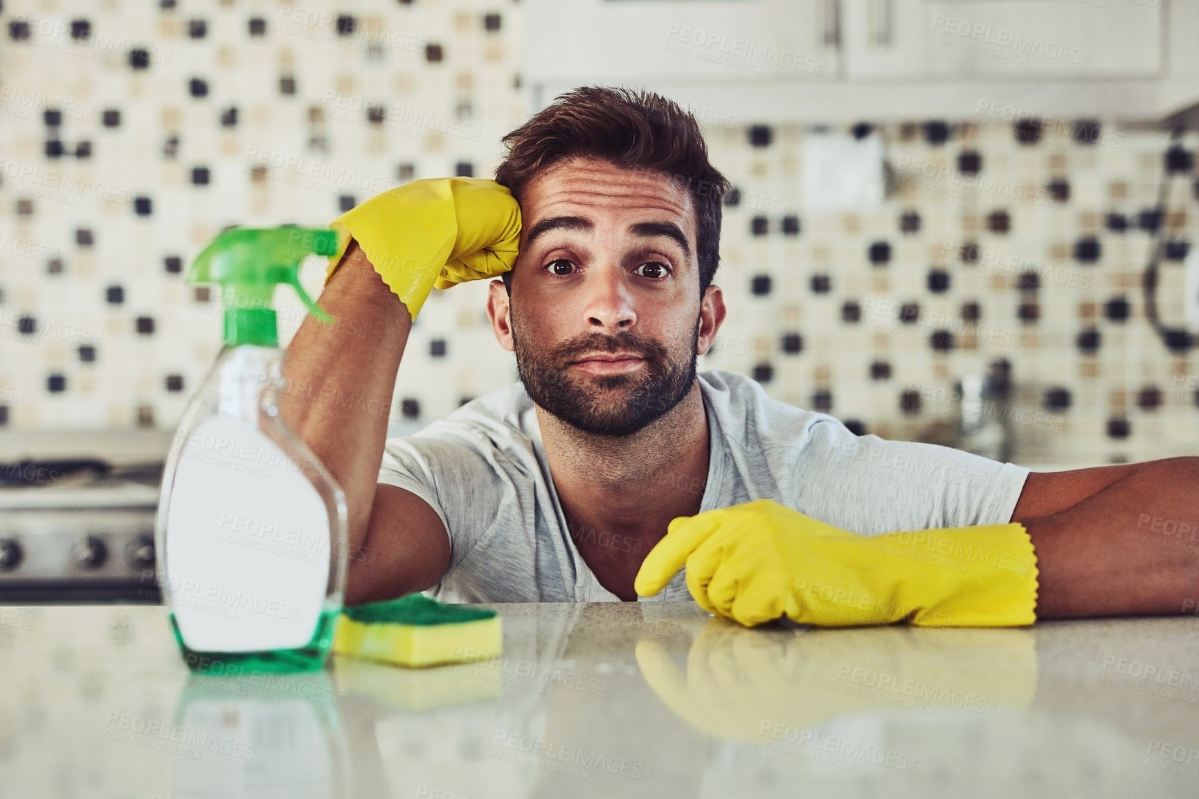 Buy stock photo Cleaning, tired and portrait of man by kitchen counter in home for sanitizing germs, bacteria or dirt. Gloves, housekeeping and person with fatigue for hygiene with table for dust in apartment.