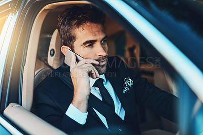 Buy stock photo Cropped shot of a handsome young corporate businessman on a call while commuting