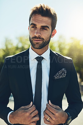 Buy stock photo Cropped shot of a handsome young corporate businessman in a public park