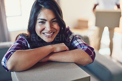 Buy stock photo Portrait of a young woman moving house