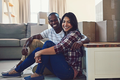 Buy stock photo Portrait of a young couple taking a break while moving house