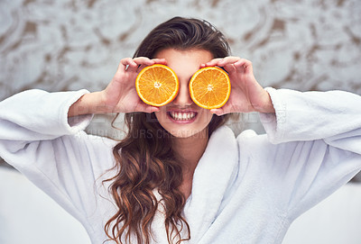 Buy stock photo Orange, beauty and smile with woman in hotel for breakfast, diet and relax. Nutrition, health and natural with female model and cover with citrus fruit in bedroom for vitamin c, spa and facial