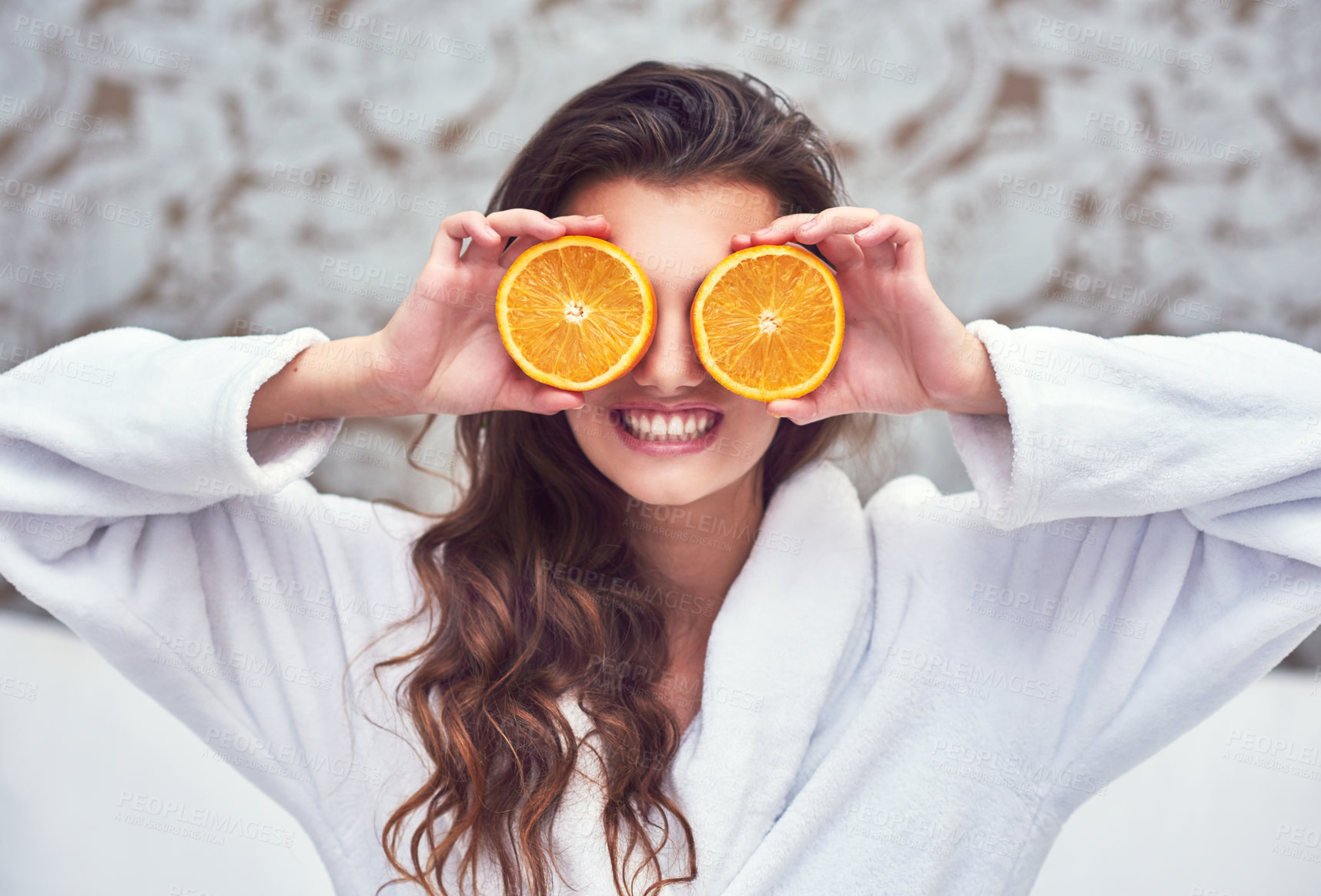 Buy stock photo Orange, beauty and smile with woman in hotel for breakfast, diet and relax. Nutrition, health and natural with female model and cover with citrus fruit in bedroom for vitamin c, spa and facial