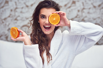 Buy stock photo Orange, beauty and hide with woman in hotel for breakfast, diet and relax. Nutrition, health and natural with female model and cover face with citrus fruit in bedroom for vitamin c, spa and facial