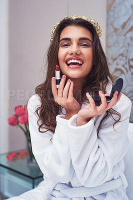Buy stock photo Portrait of an attractive young woman applying lipstick at home