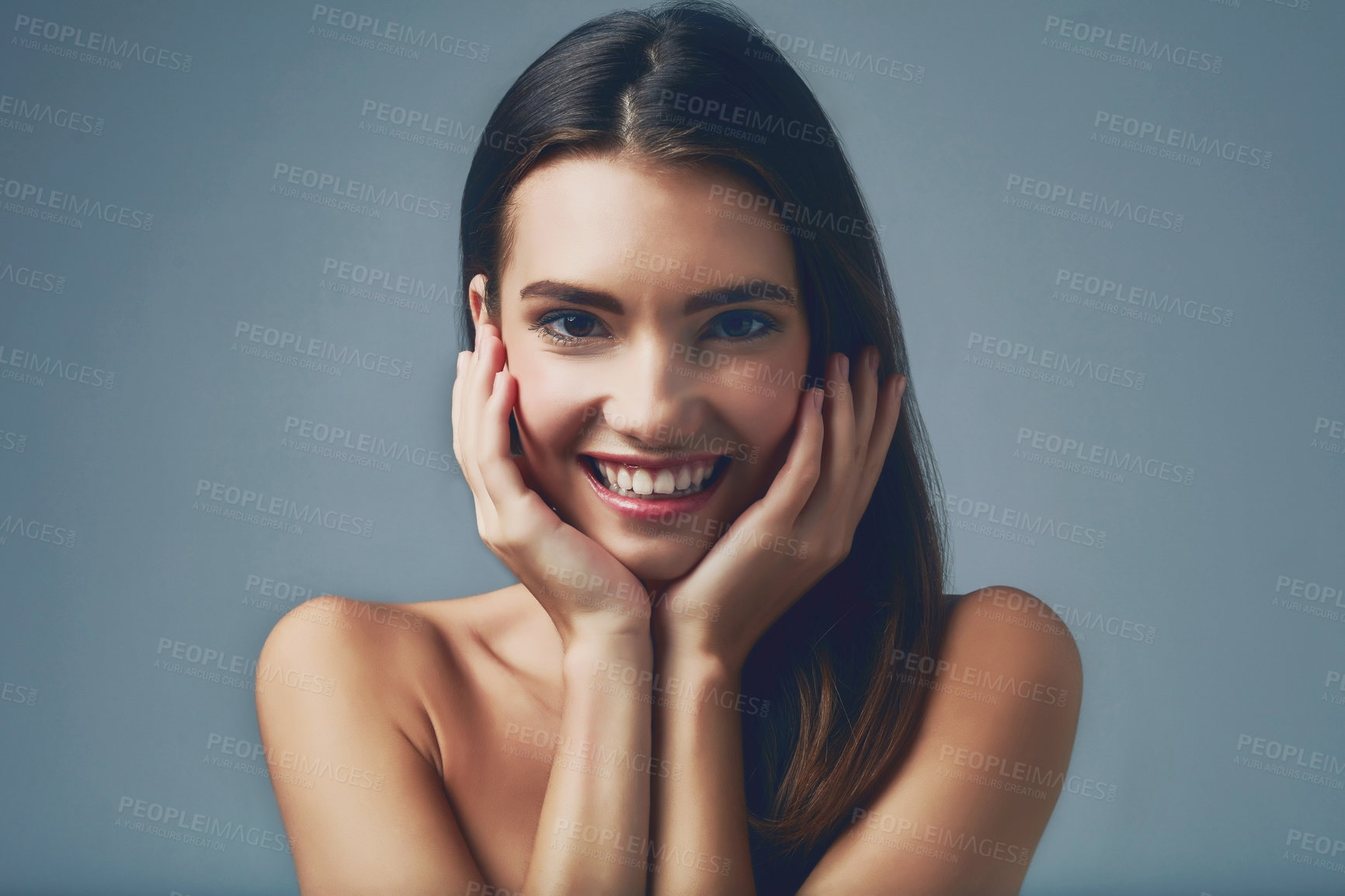 Buy stock photo Beauty, happy and portrait of girl for skincare on blue background for smooth face, detox or natural glow. Flawless, smile or confident model in studio with cosmetics, shine or transformation results