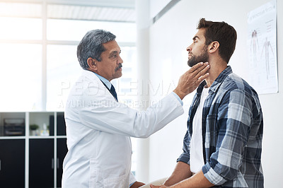 Buy stock photo Healthcare, consultation and doctor checking neck of patient with advice, help and examination. Medicine, health care and Indian man with throat pain in doctors office consulting medical professional