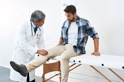 Buy stock photo Clinic, patient and doctor with leg exam, consultation and wellness checkup of person at hospital. Medicine, health care expert and man in doctors office consulting medical professional for knee pain