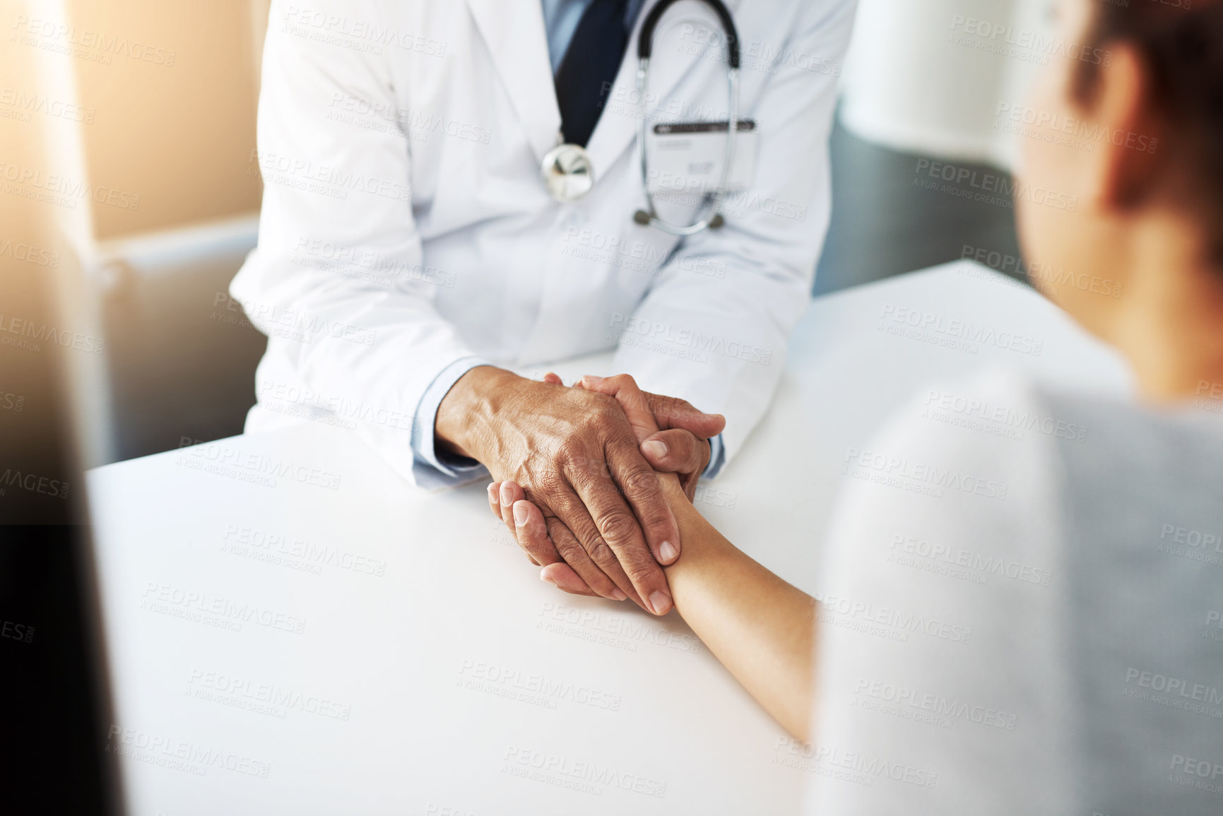 Buy stock photo Holding hands, doctor and patient for care, talking or communication for bad news, diagnosis or support. Cardiologist, medical discussion or empathy together for comfort, help or wellness in hospital