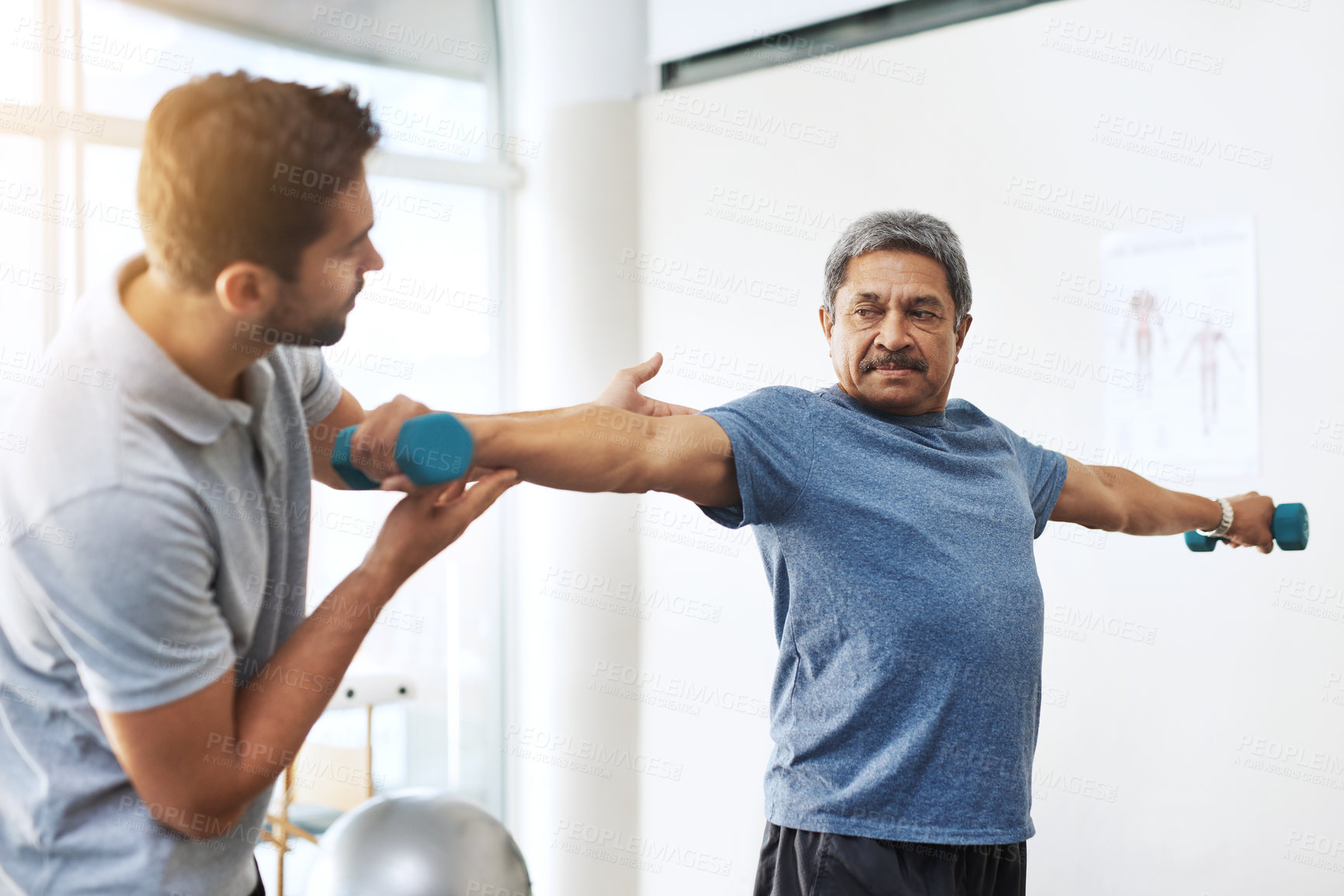 Buy stock photo Dumbbells, physiotherapy and help with doctor and patient for rehabilitation, training and stretching. Healthcare, wellness and healing with old man and expert for consulting, muscle and exercise