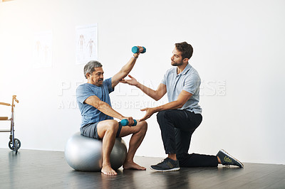 Buy stock photo Dumbbells, physiotherapy and exercise with doctor and old man for rehabilitation, training and balance. Health, pain and healing with senior patient and physiotherapist for consulting, muscle or help