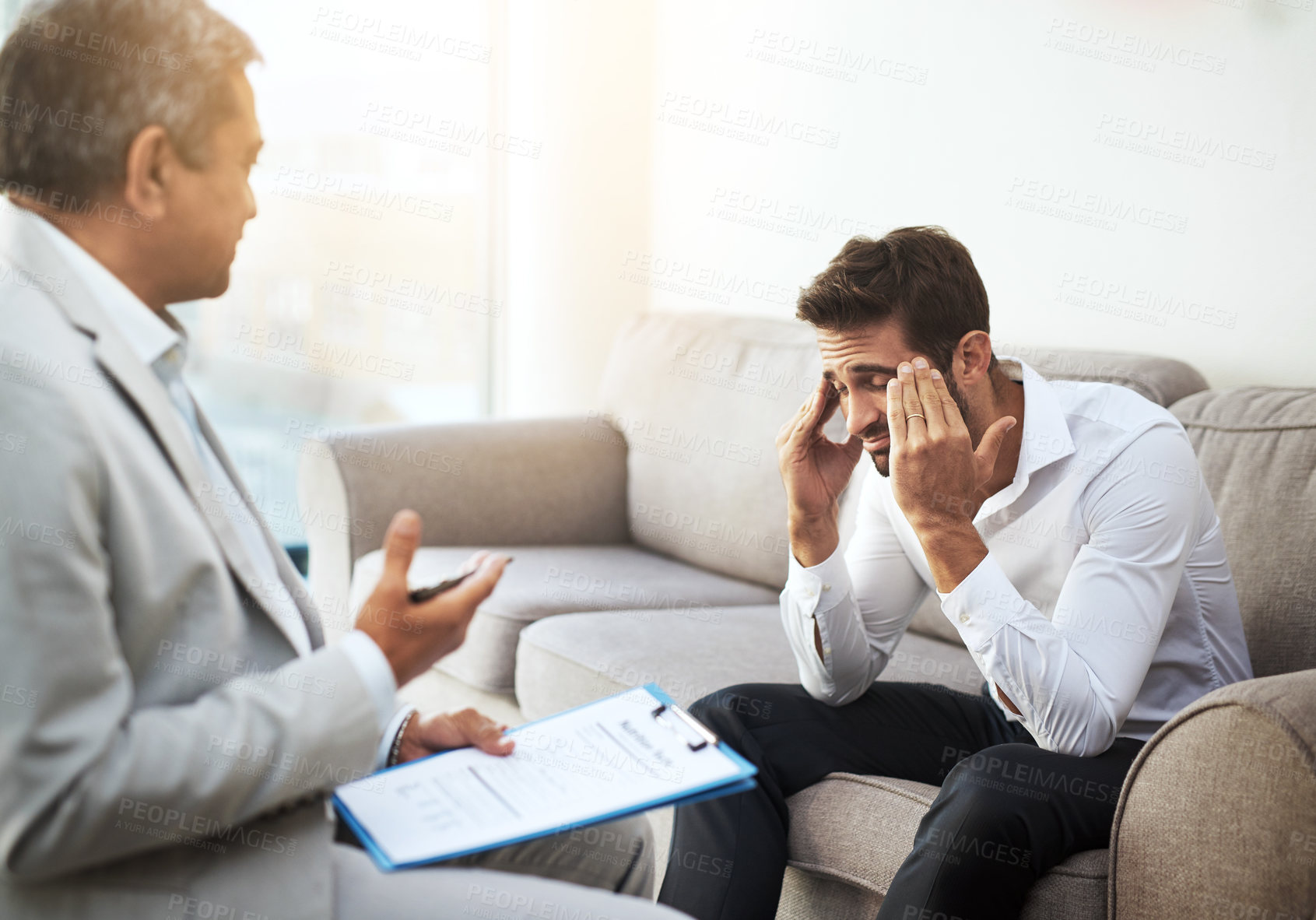 Buy stock photo Men, doctor and patient at clinic with headache on consultation, checkup and examination. People, healthcare and discussion with document for migraine symptoms, sickness and diagnosis at office