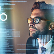 Taking a look at the source code | Buy Stock Photo on PeopleImages ...