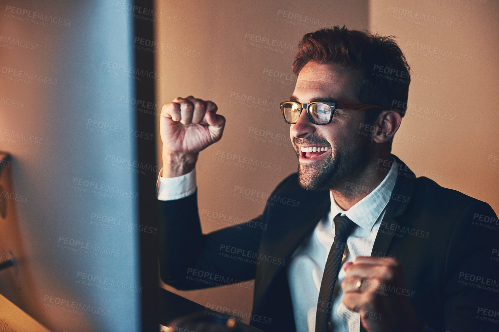 Buy stock photo Office, computer and businessman with celebration at night for exchange, success and currency growth. Stock broker, happy and fist with achievement by tech for investment, profit or increase of value