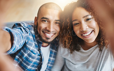 Buy stock photo Smiling couple taking selfies as home owners, bonding together or enjoying new real estate purchase. Portrait of a happy man and woman celebrating and capturing memory picture as home investors