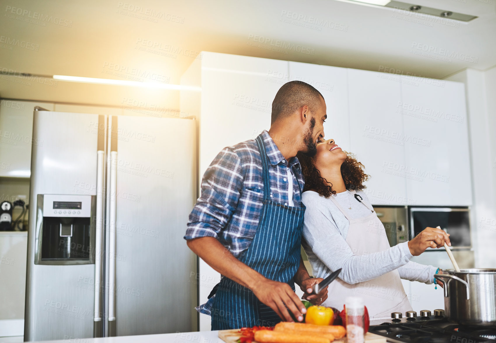 Buy stock photo Couple, funny and cooking in kitchen at house for romantic dinner, happy and date with love. People, relationship and meal prep in home for bonding, wellness or eating food together with vegetable