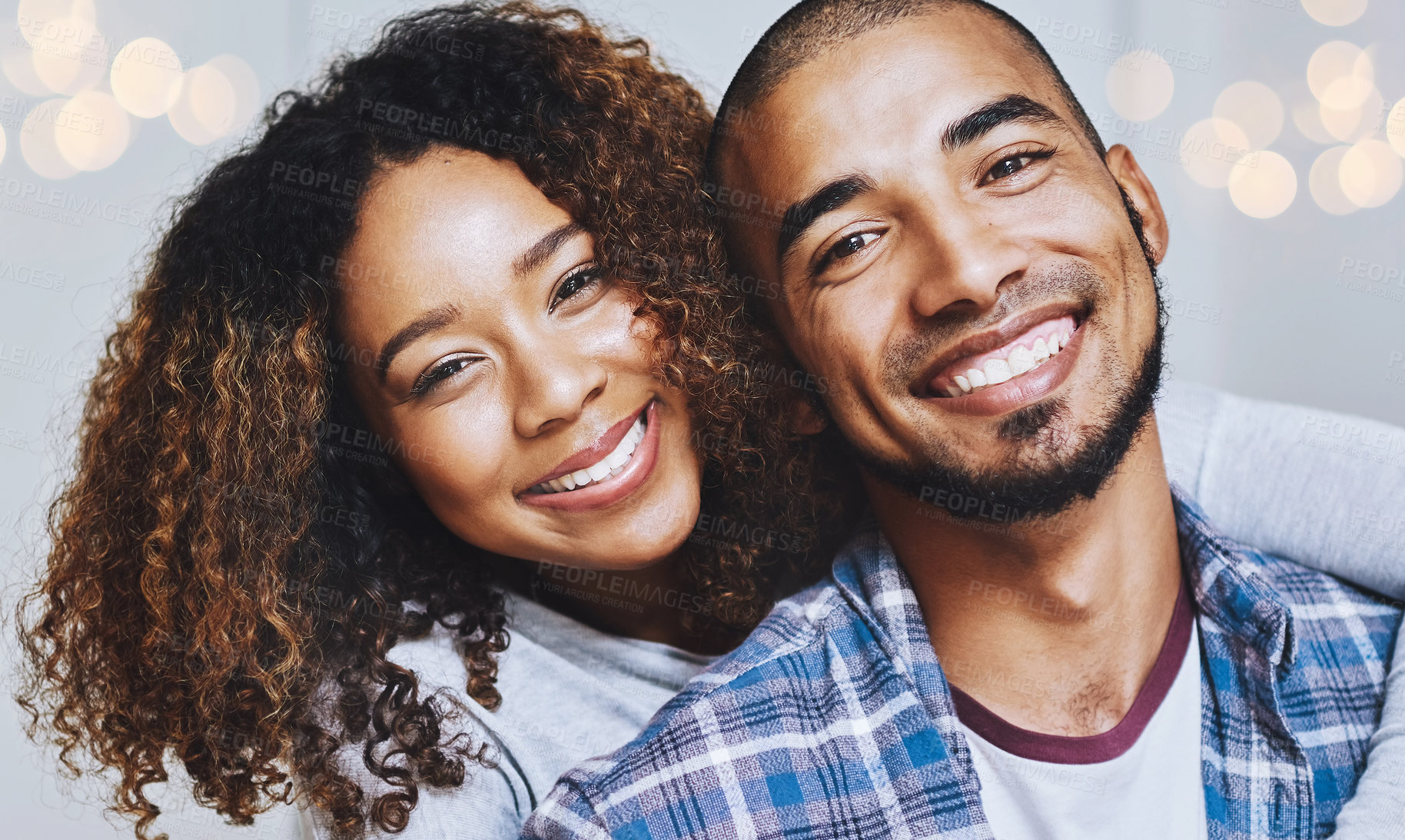 Buy stock photo Happy couple, portrait and hug with love for relationship, commitment or bonding together on bokeh background. Man, woman or lovers with smile for care, trust or loyalty in joy for weekend or holiday