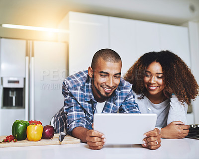 Buy stock photo Couple, tablet and cooking food in kitchen at home with blog, internet website and online connection. Happy African man, woman and digital recipe for reading instruction of healthy vegetarian meal